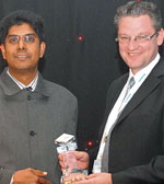 Vinesh Maharaj (left) from Cube Technologies accepts the award from Heiko Katheder as well as the award for best performing systems integrator 2008